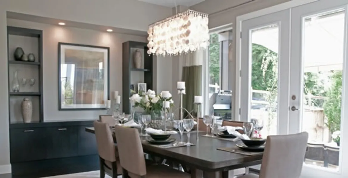 Elegant dining room chandelier installation above table in Naperville, IL